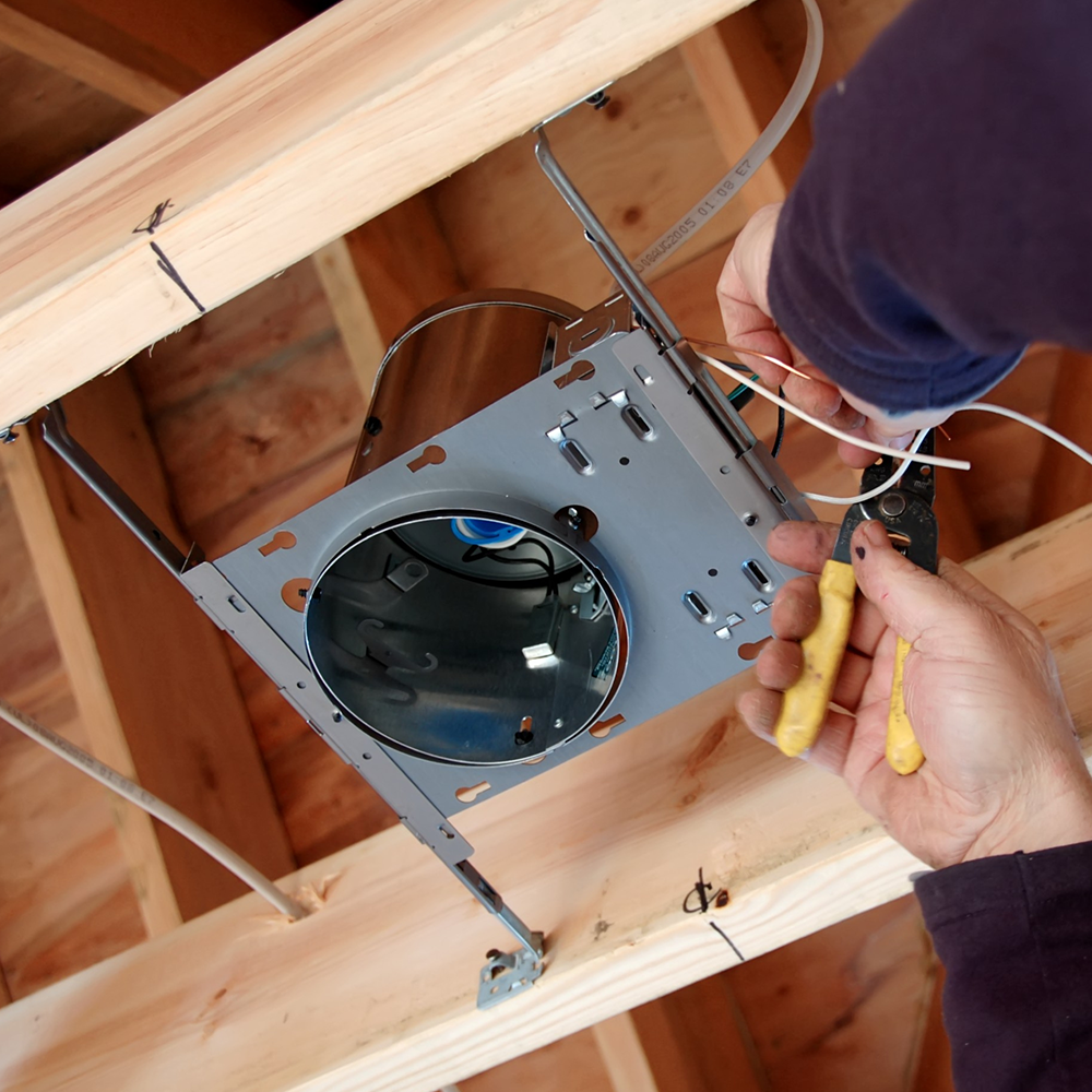 Worker installing new laminated wooden floors